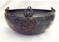 This is a hanging bowl dating from 500 to 800. It was used as a cremation vessel at Baginton Cemetery.